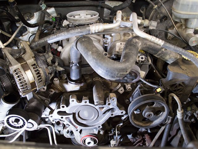 Auto Mechanic Water Pump Replacement